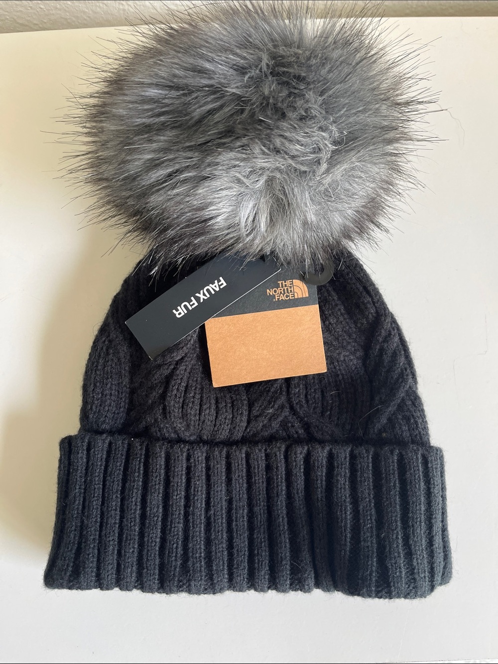 The North Face Kids Black Knit Beanie with Gray Faux Fur Pom